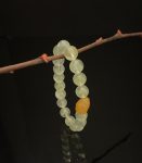 Natural crystal bracelet with an icy clear green color and full crystals. Each crystal bead has a length of 9.4mm. It uses a yellow agate bead as the head bead, which has a length of 15.1mm and a width of 11.8mm.