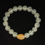 Natural crystal bracelet with an icy clear green color and full crystals. Each crystal bead has a length of 9.4mm. It uses a yellow agate bead as the head bead, which has a length of 15.1mm and a width of 11.8mm.